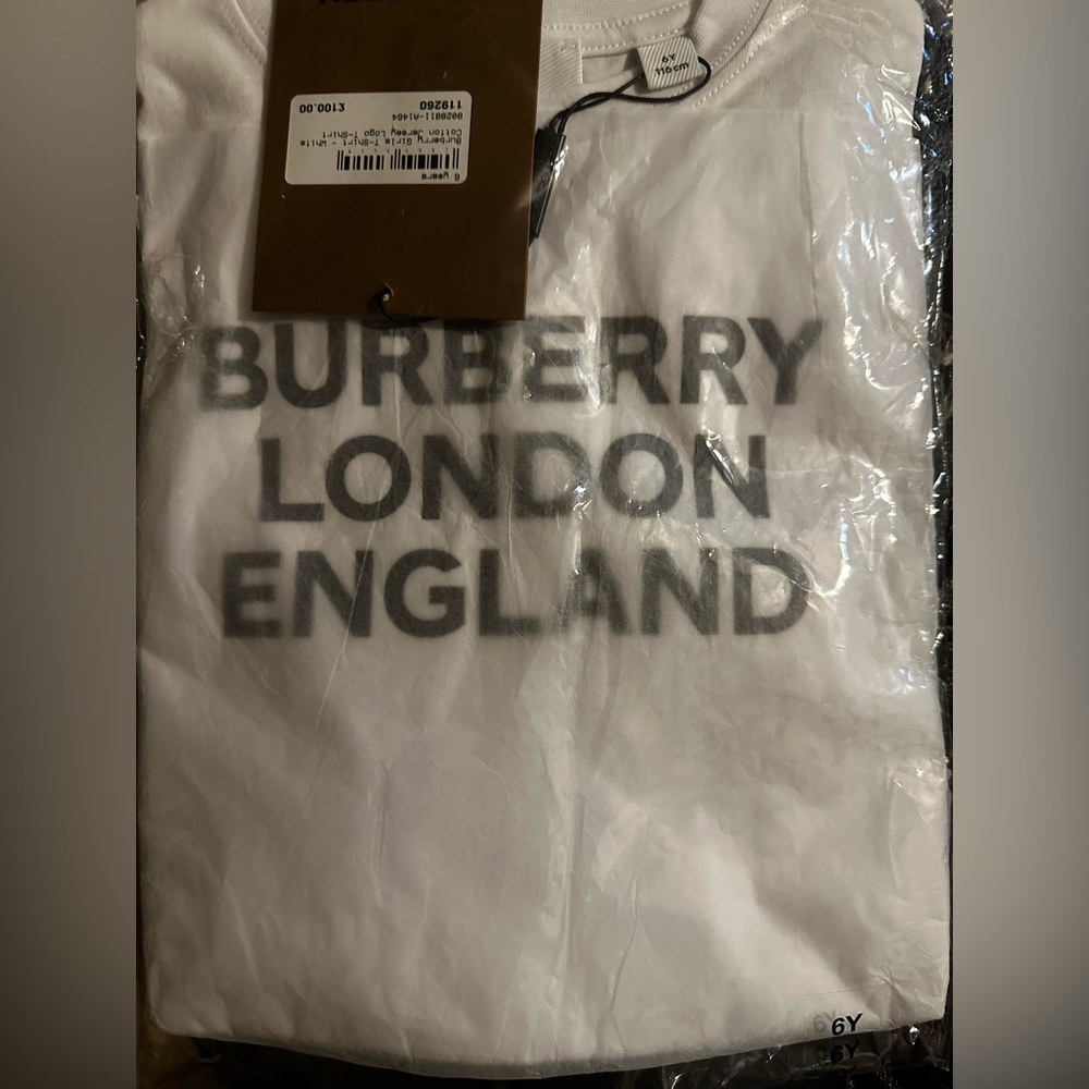 Size 6 in youth brand new never worn Burberry shirt. Way too big for my child
